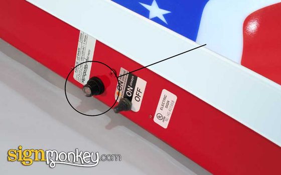 Photo eye sensor for an illuminated sign