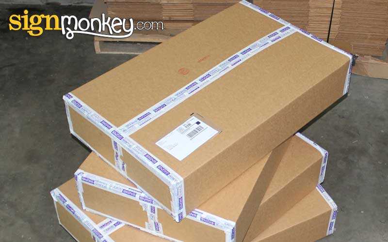 UPS packages prepared for shipping SignMonkey signs