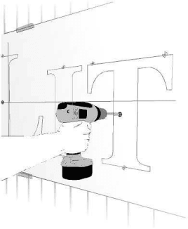 Drill a three quarter inch power hole through the wall for EZLit channel letter wiring