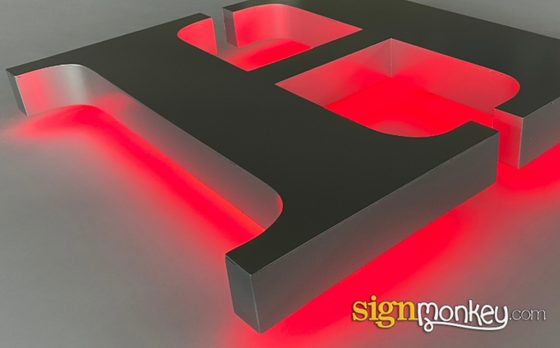 Halo lit channel letters glowing against a wall